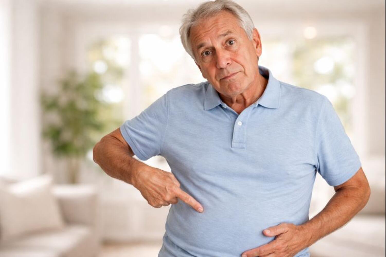 Uomo che indica l'intestino